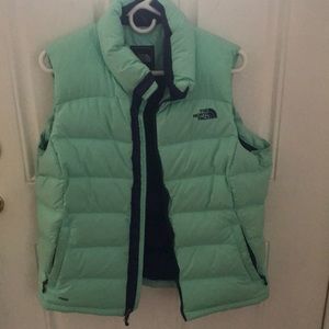 The North Face puffy vest —worn 3 times.  Mint green with blue trim.